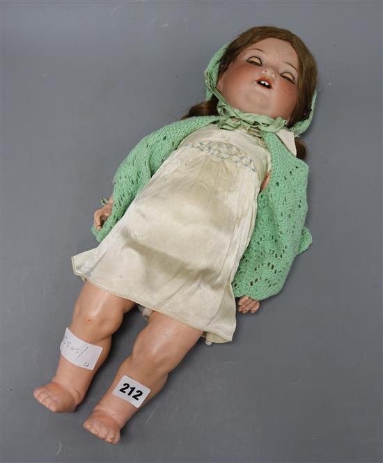 An A.M. bisque headed open mouth doll